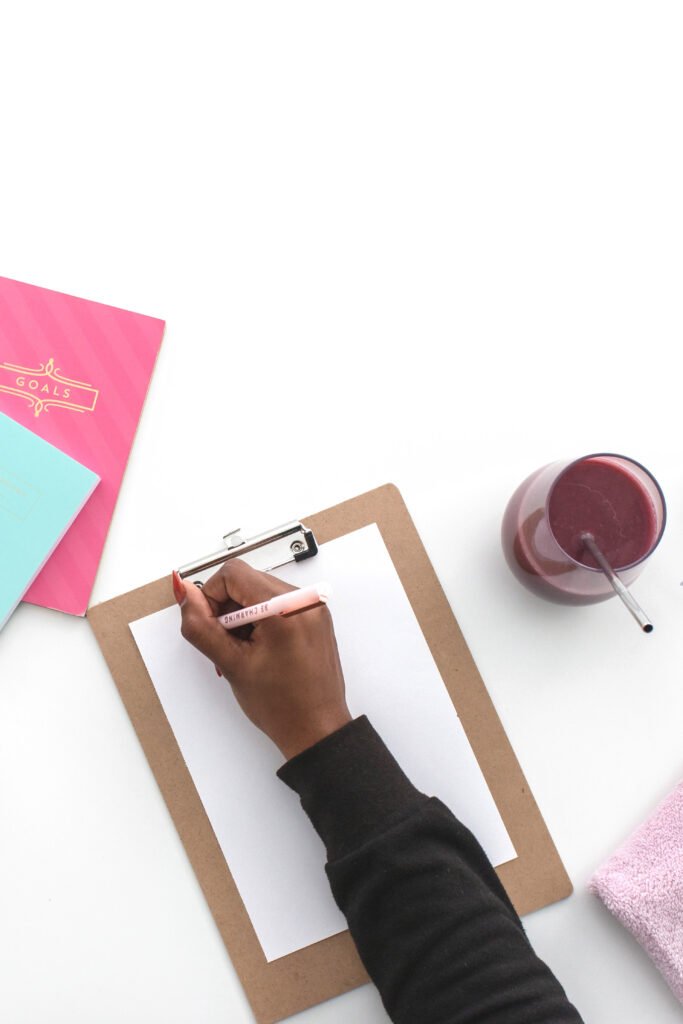Woman writing on pages