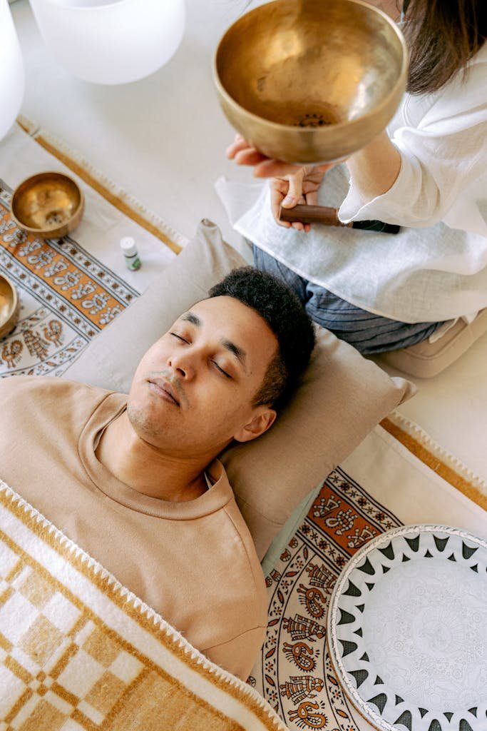 A serene therapy session using Tibetan singing bowls for relaxation.