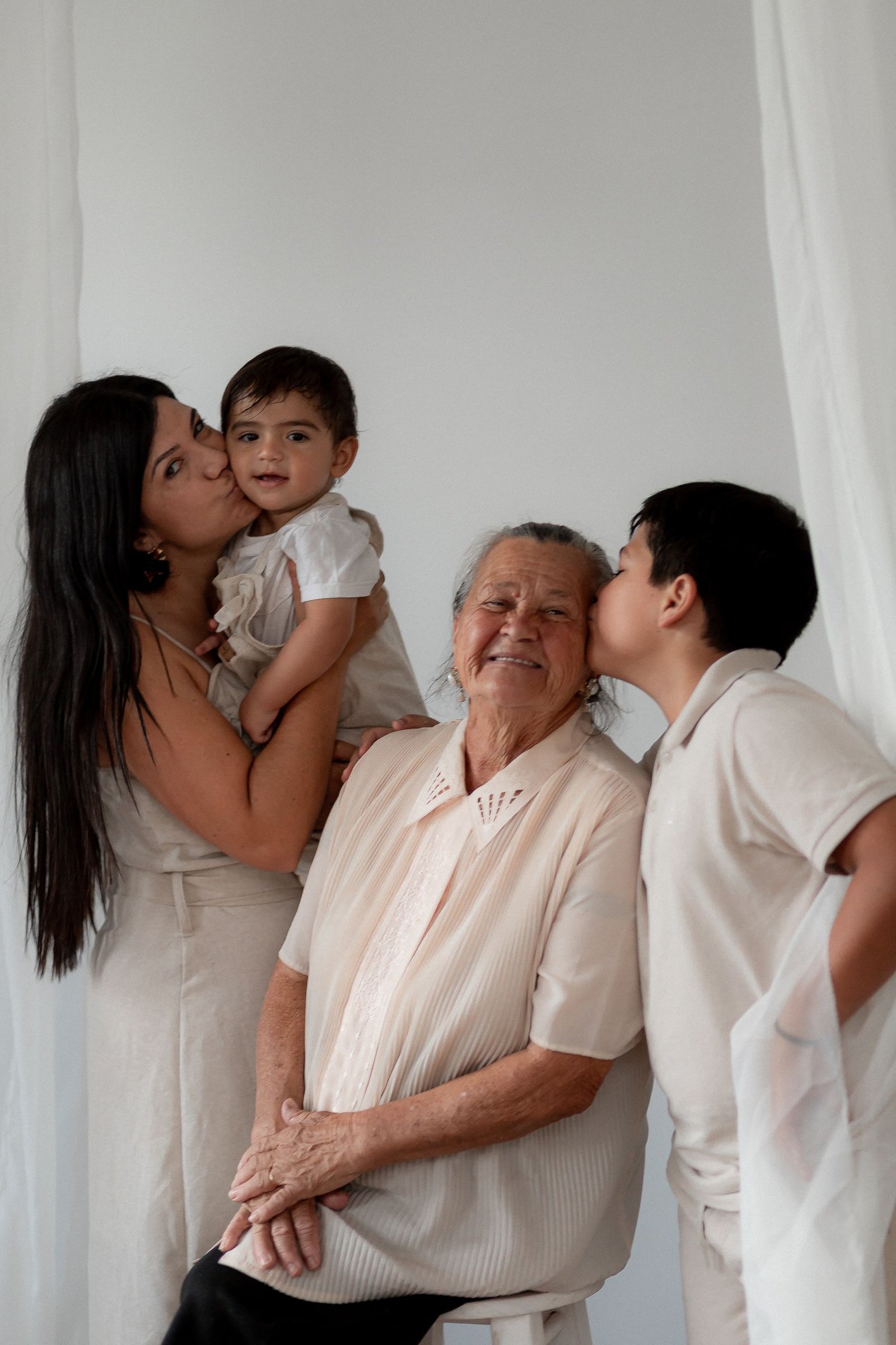 Heartwarming moment of three generations celebrating together indoors.